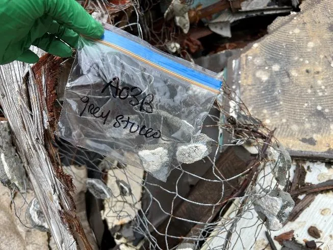 North of stockpile — Storage tank — Hazardous Material: Possible hydrocarbons