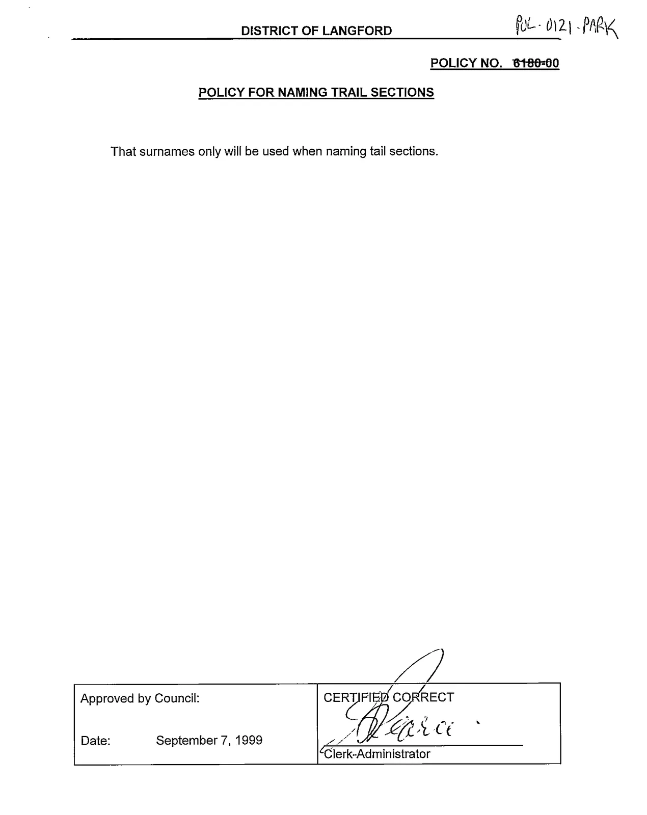 scanned page of the policy showing approval block and date