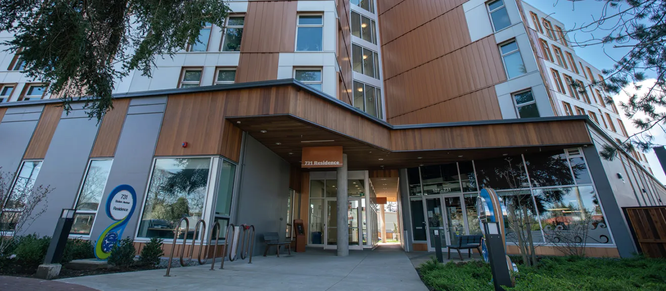 Mixed-use building with residential units above ground-floor retail.