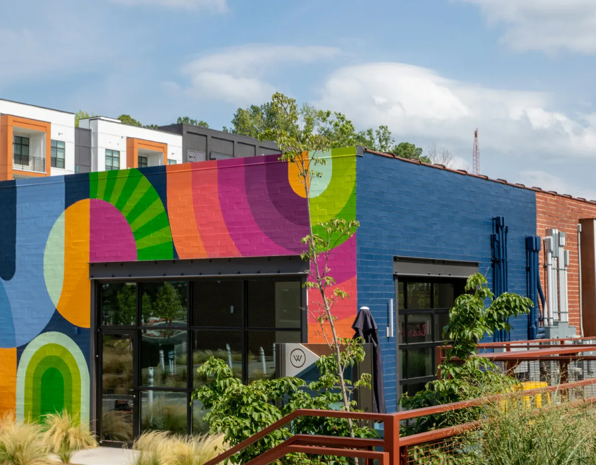 Public art and sculpture integrated into a building setting.