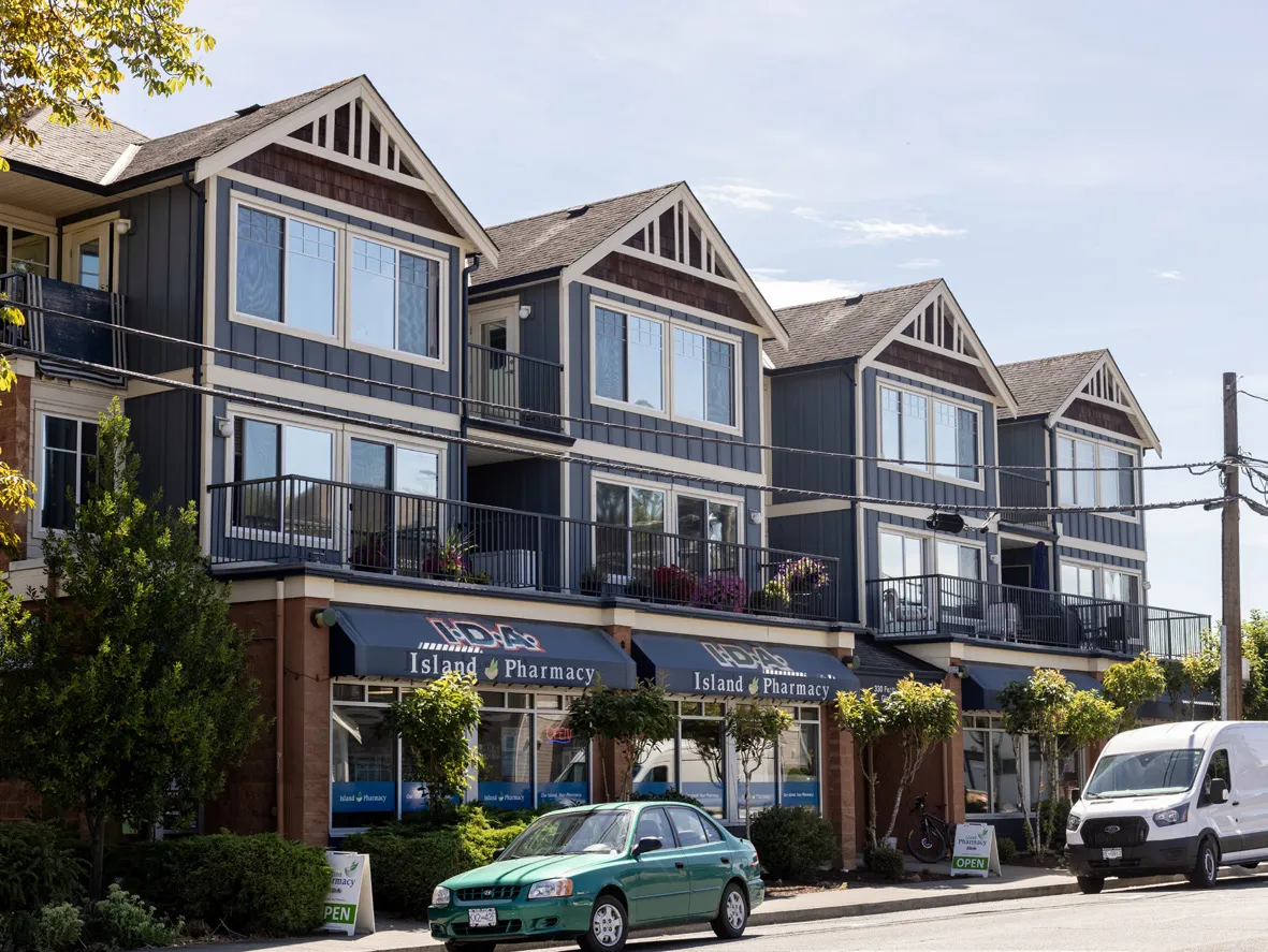 Ground-floor commercial units distinguished from apartments above.