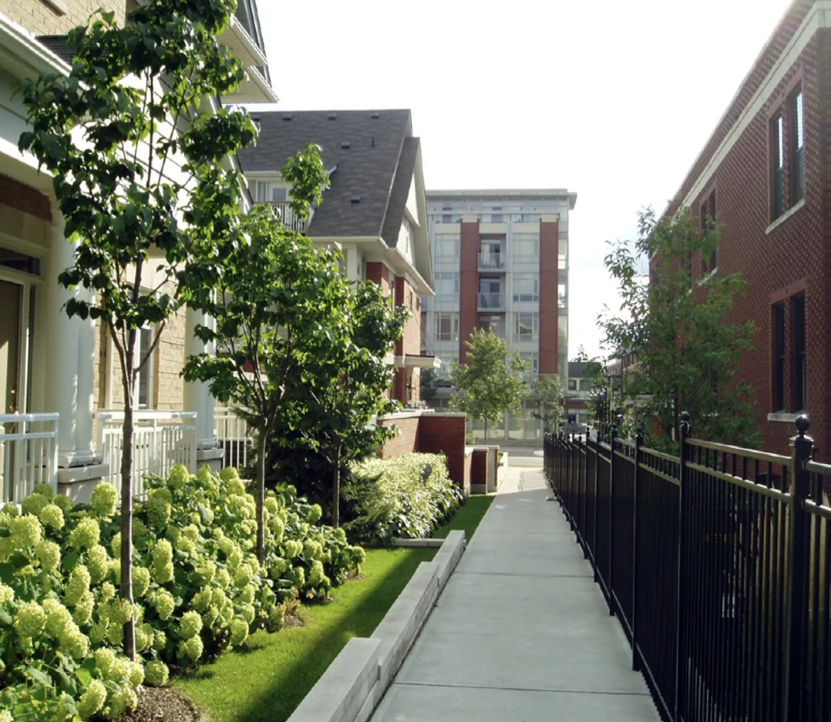 Parking lot with landscaped bioswales between parking stalls.