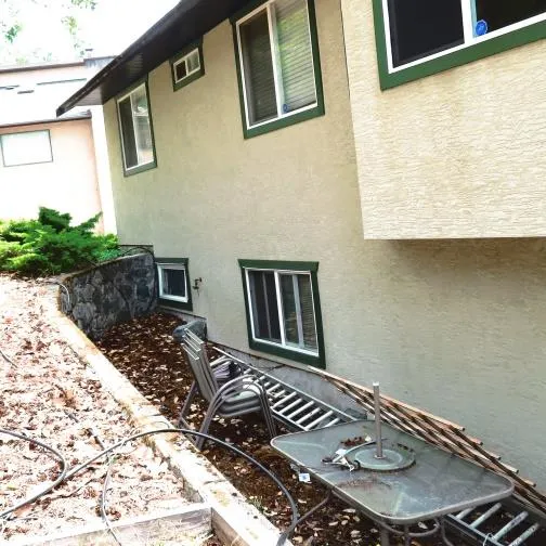 Photo — Top left: Deck would extend from “side” of home